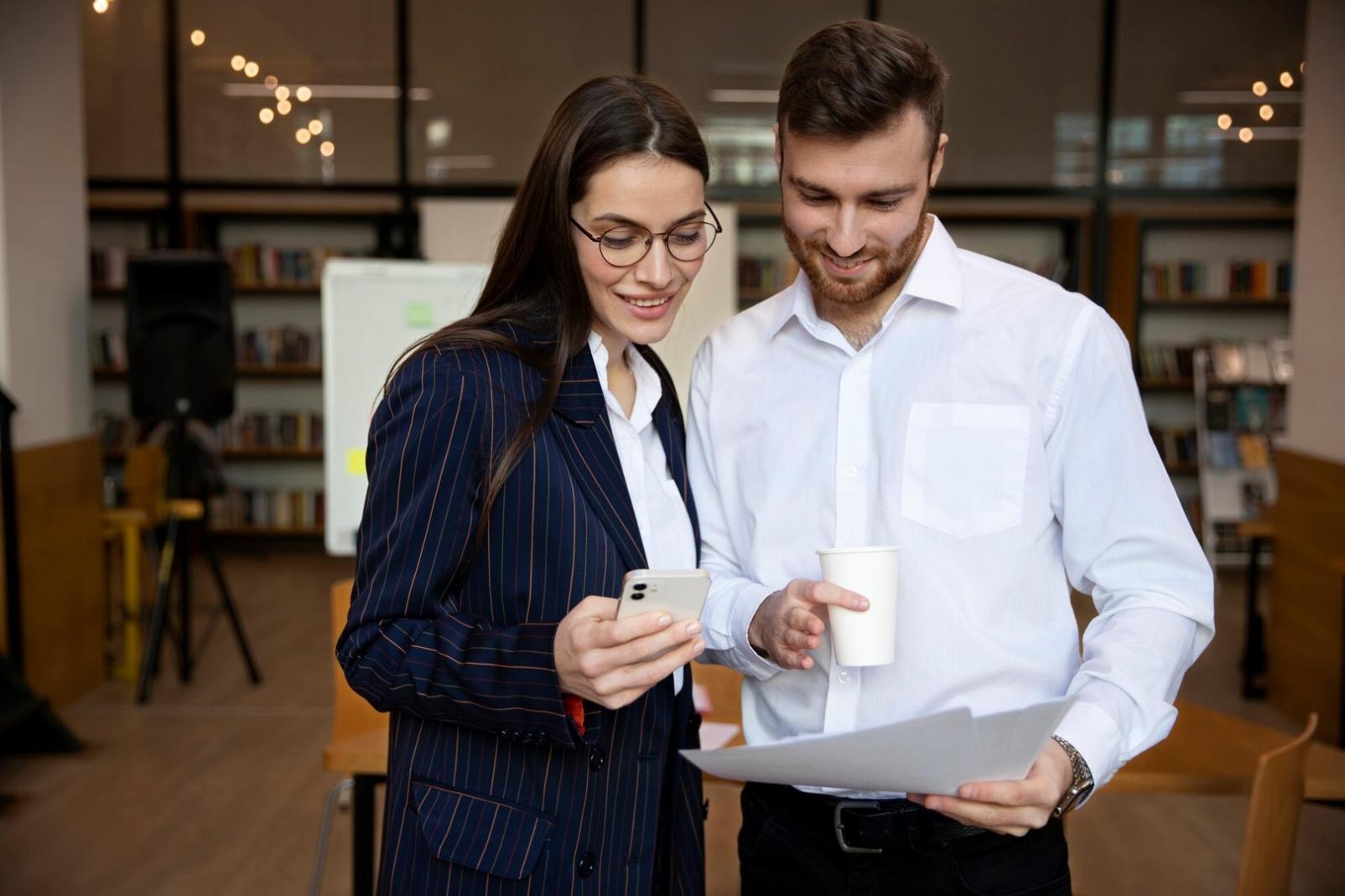 Professional financial consultation meeting with documents and digital tools